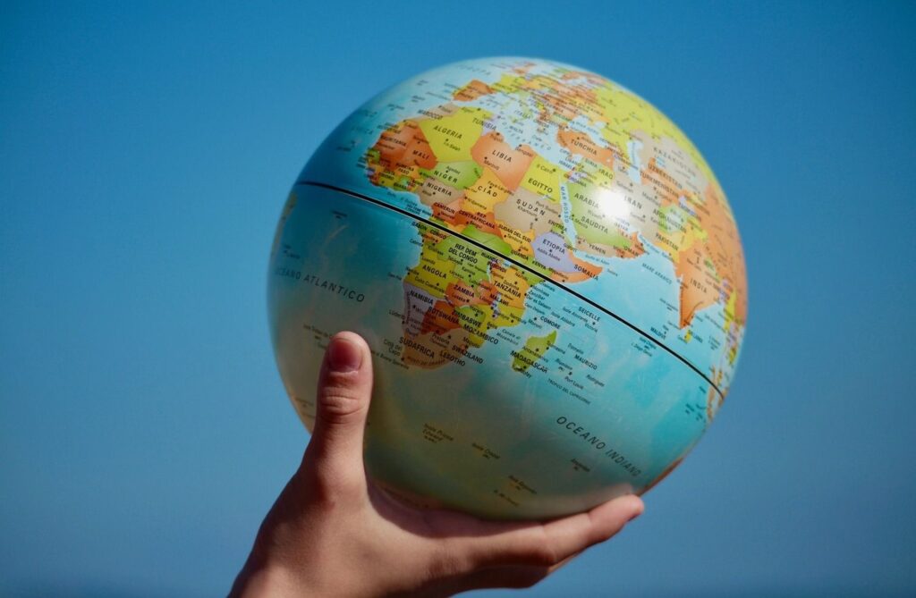 Person holding a globe